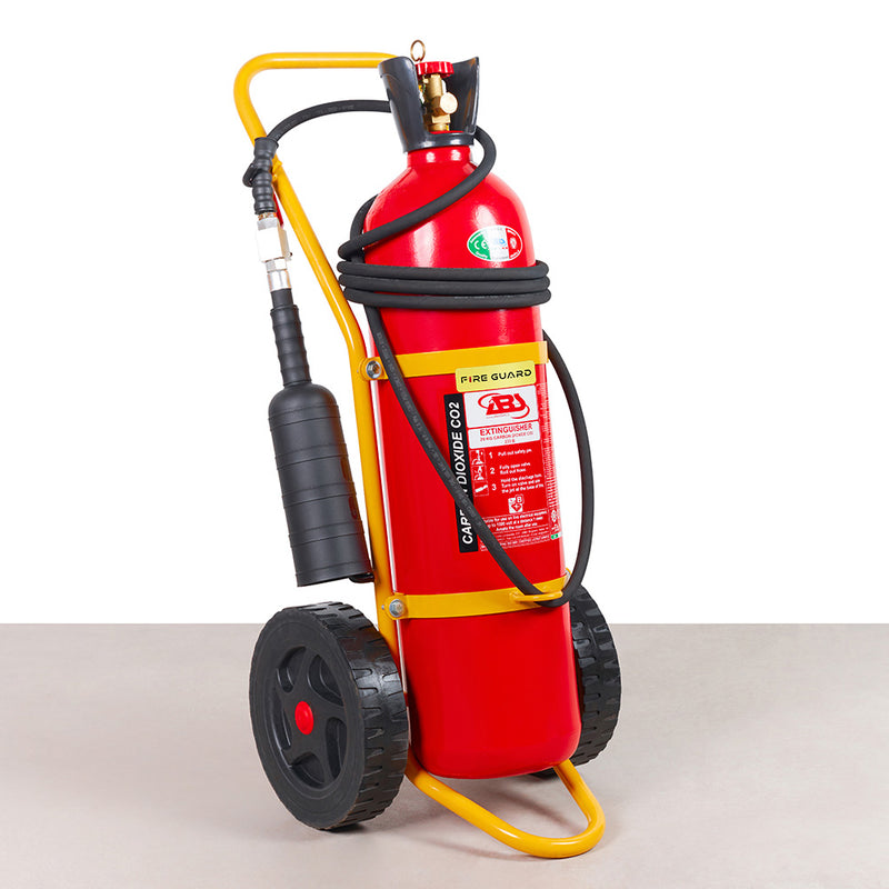 A red wheeled fire extinguisher with a yellow frame and black wheels, equipped with a hose and a nozzle - fire guard