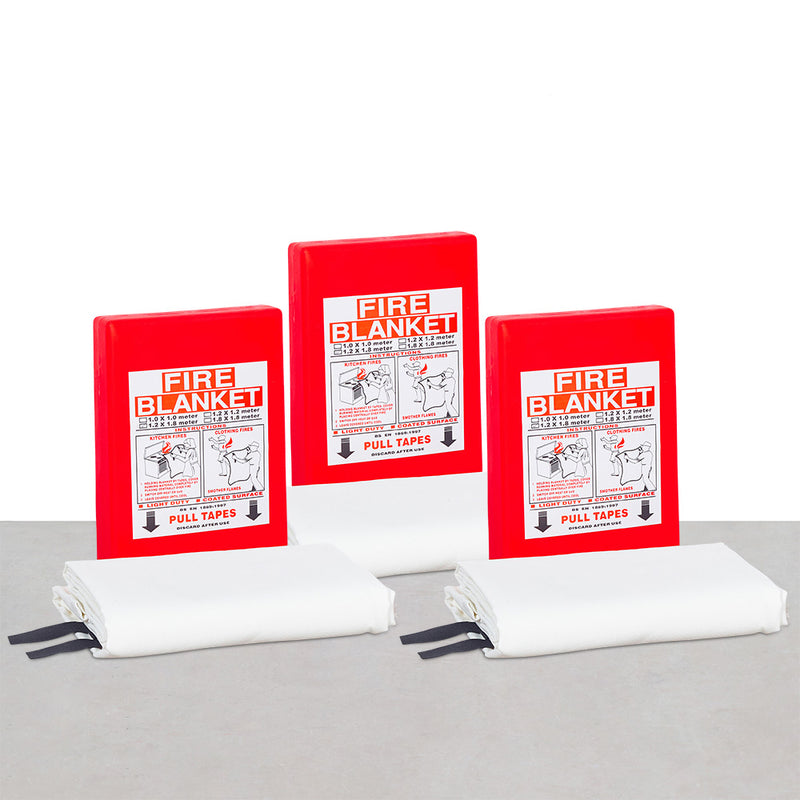 Three red fire blankets with instructions and a diagram on the cover, placed on a grey surface - fire guard