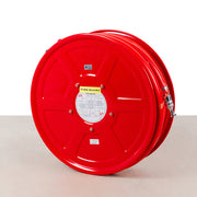 A red fire hose reel with a metallic nozzle - fire guard