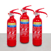 A set of three red fire extinguishers with labels and a wire bracket for each.
