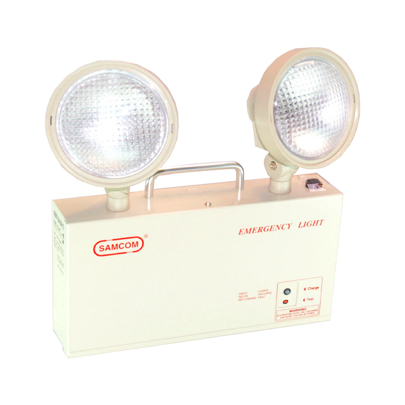 A SAMCOM emergency LED light with twin lamps, featuring a white casing with emergency light labeling and an adjustable angle projection lamp - fire guard