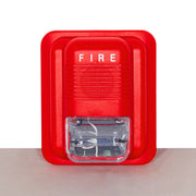 A red fire alarm siren with a clear strobe light beneath it - fire guard